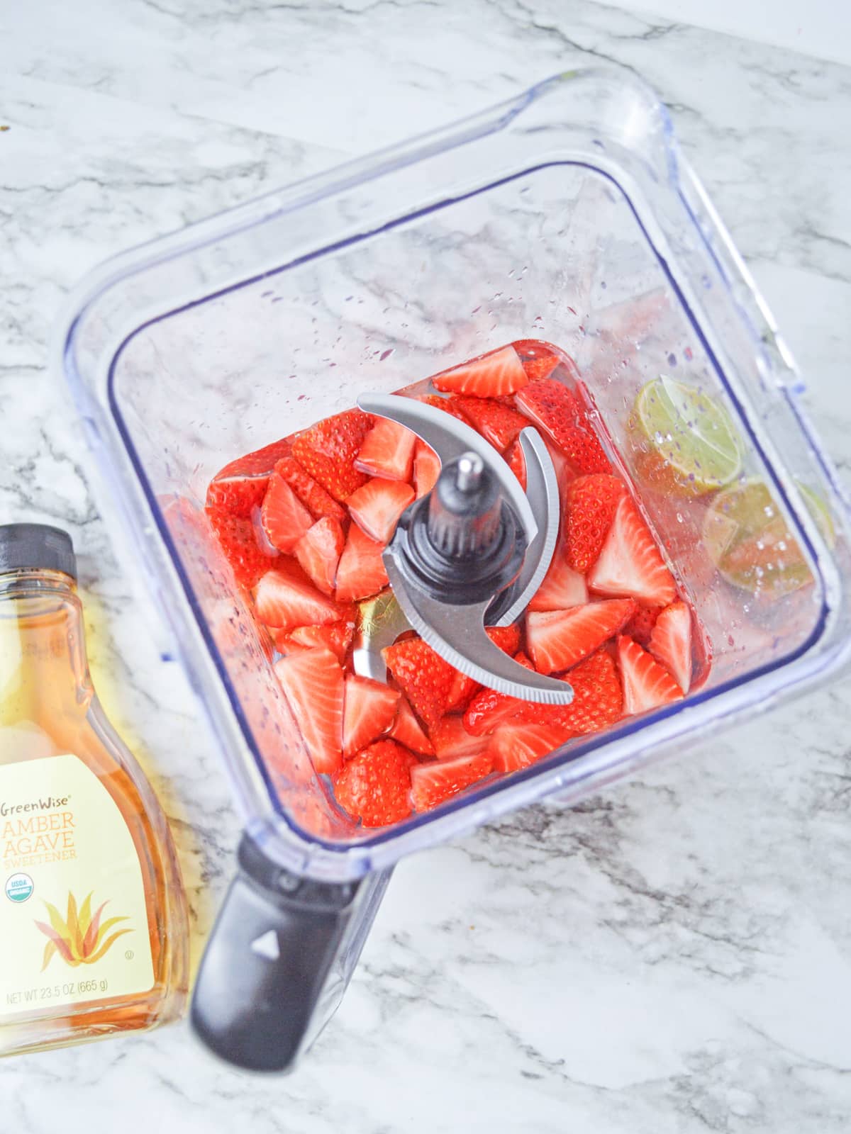 place chopped strawberries with water and sweetener in a blender