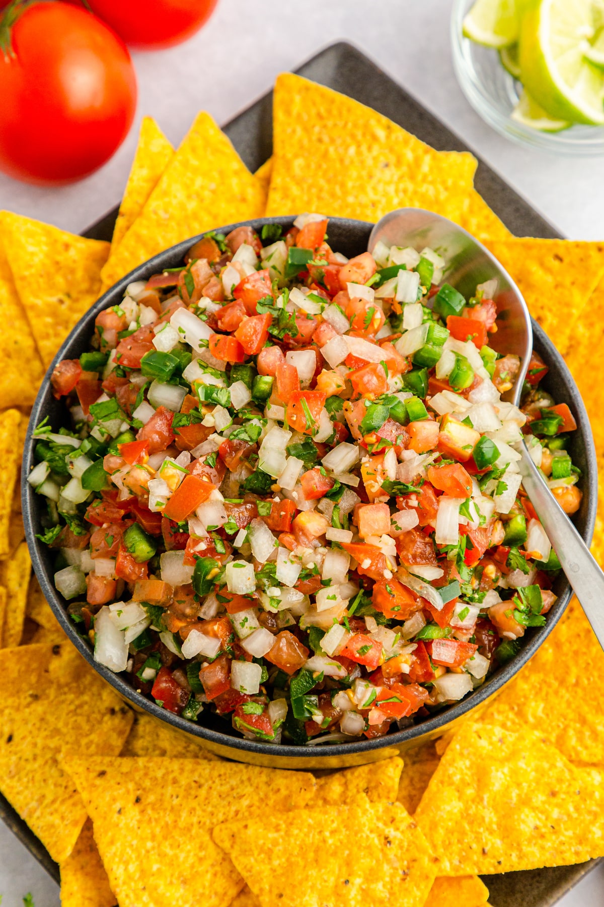 Add pico de gallo to serving bowl with spoon and serve with chips or as a topping