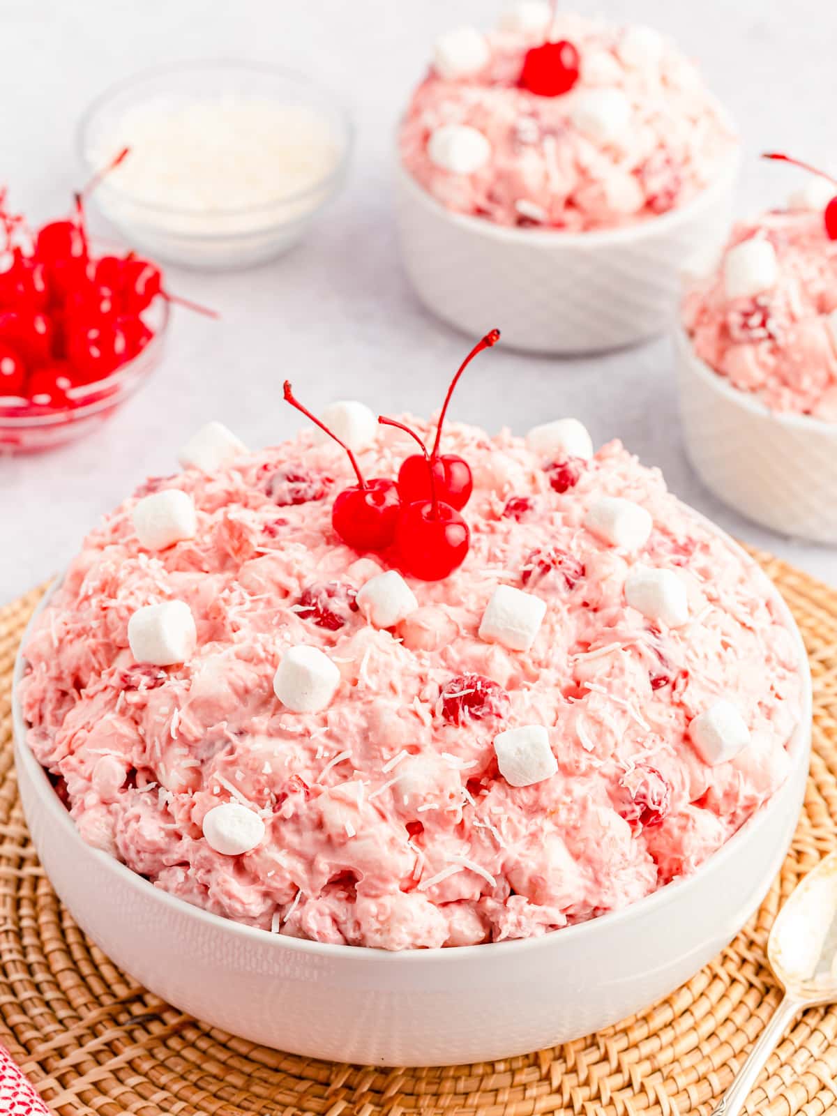 Cherry Fluff Salad in serving bowl and single bowls