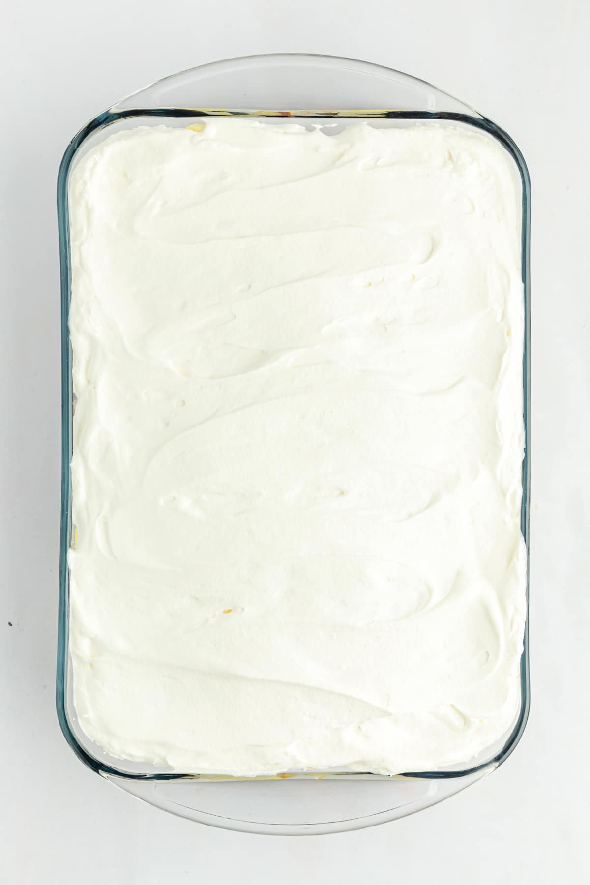 Cool Whip topping spread evenly in baking dish