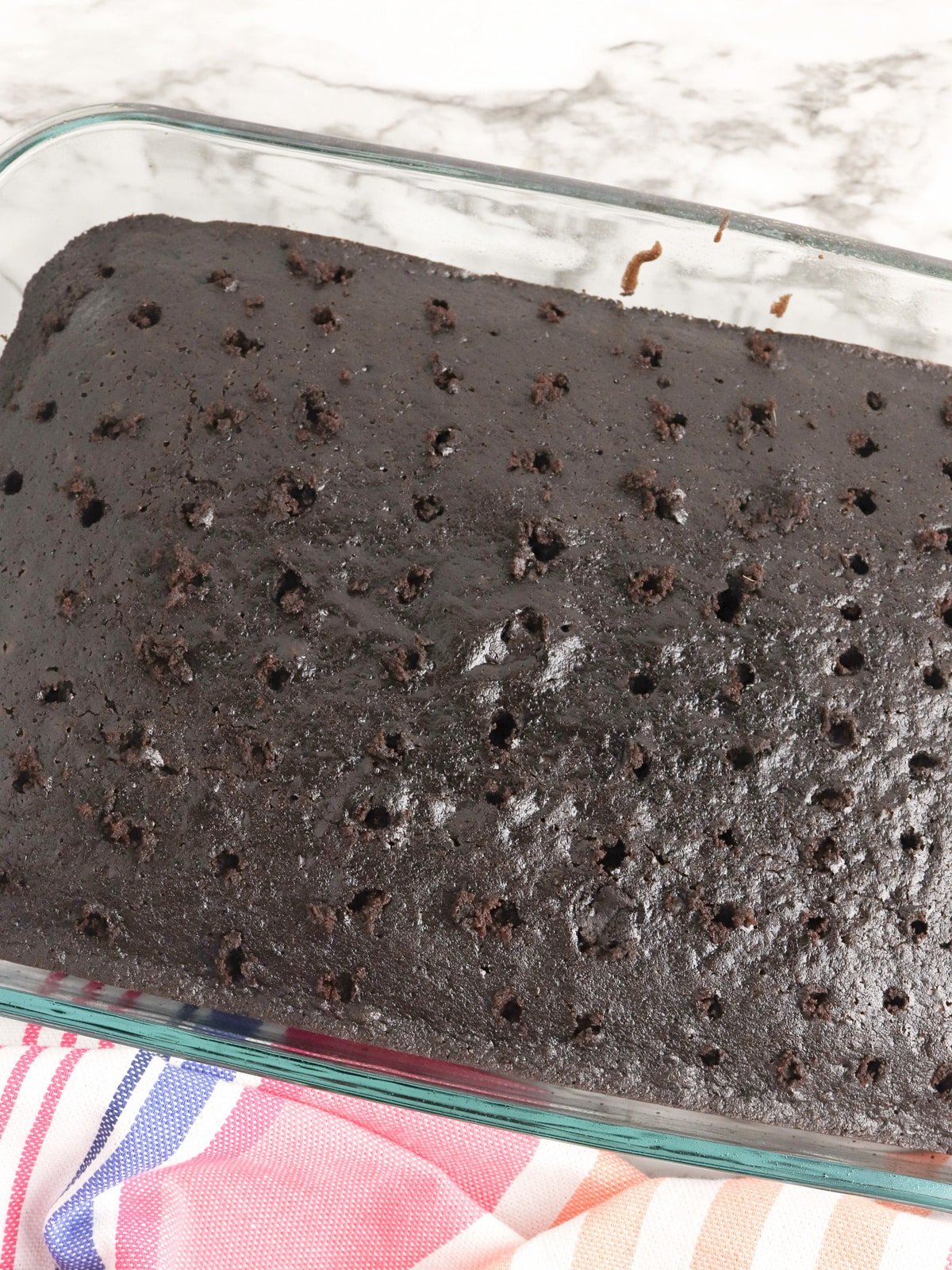 Hot Fudge Poke Cake with holes