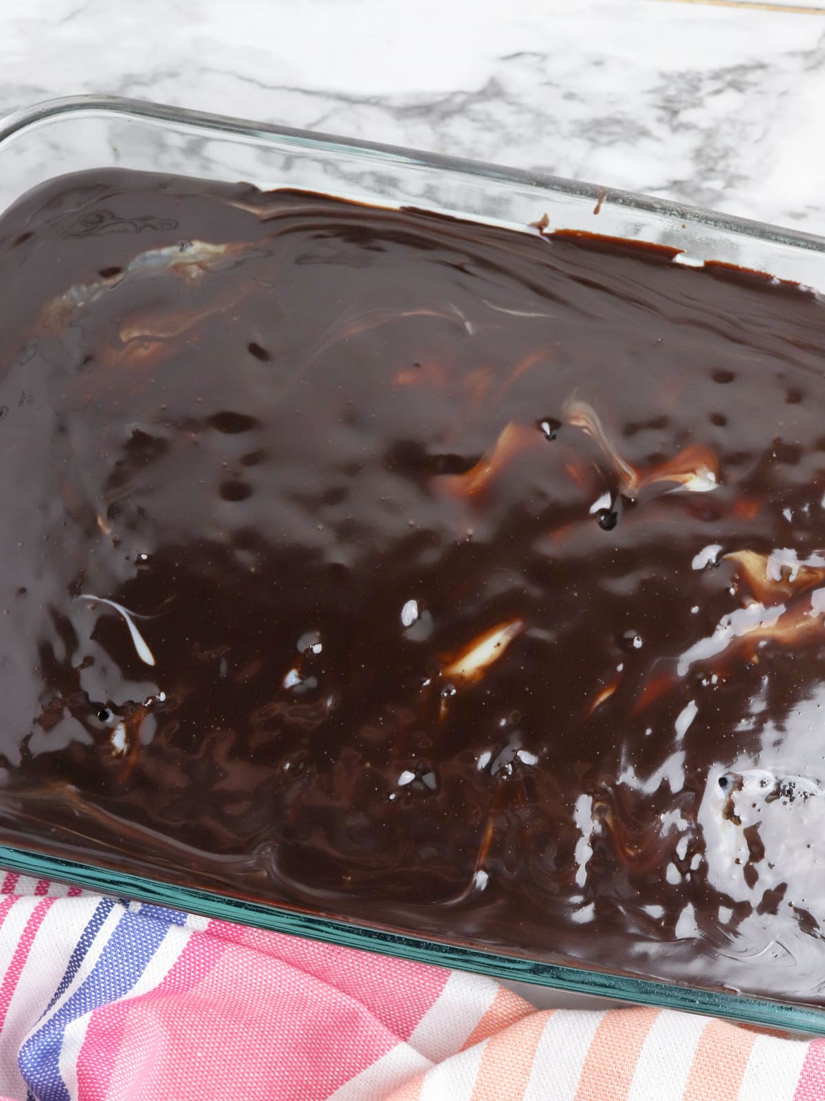 Hot Fudge poured over cake in pan