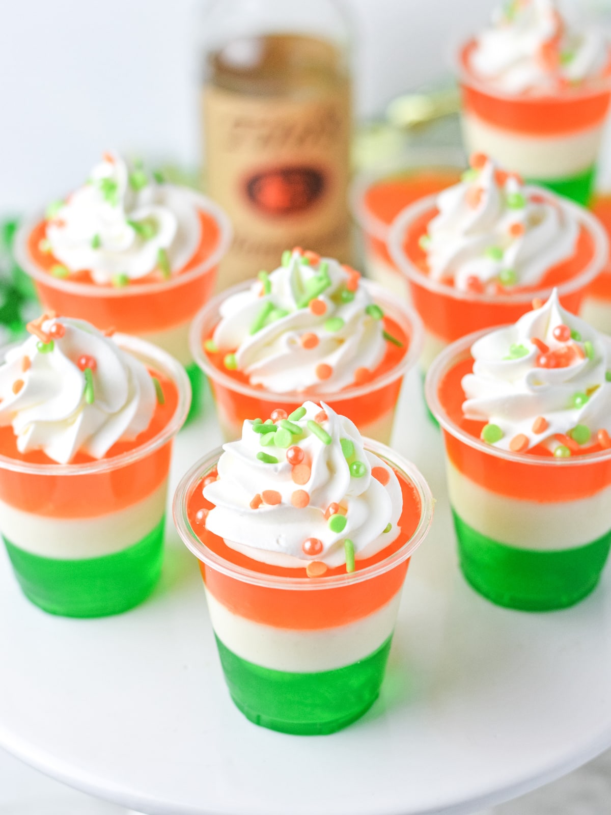Irish Flag Jello Shots with whipped cream and sprinkles one serving tray