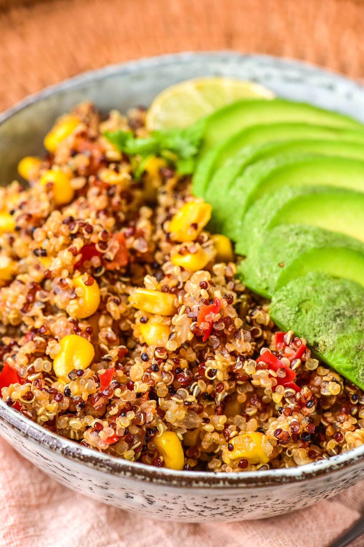 Spicy Quinoa ready to eat with avocados in serving bowl