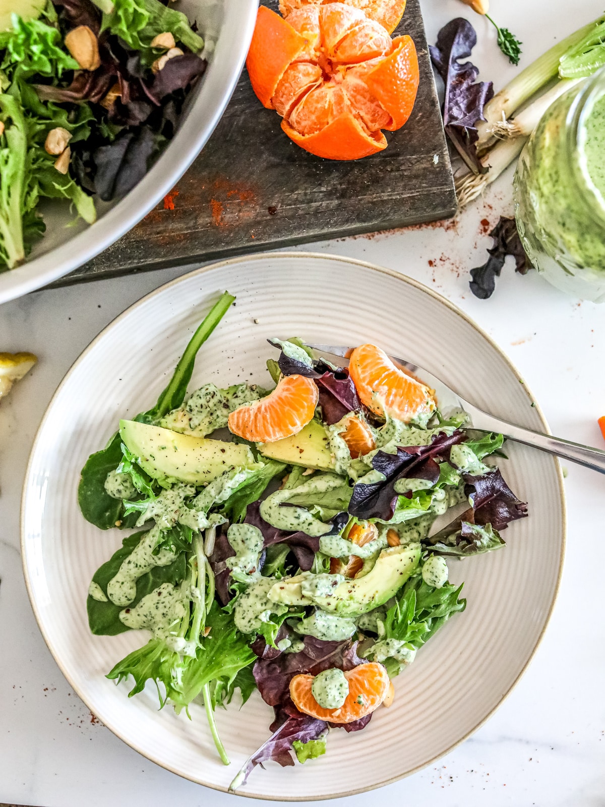 Spring Salad and Dressing on a plate with fork