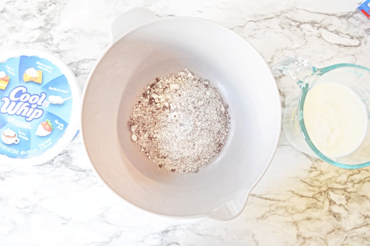combine frosting ingredients in mixing bowl