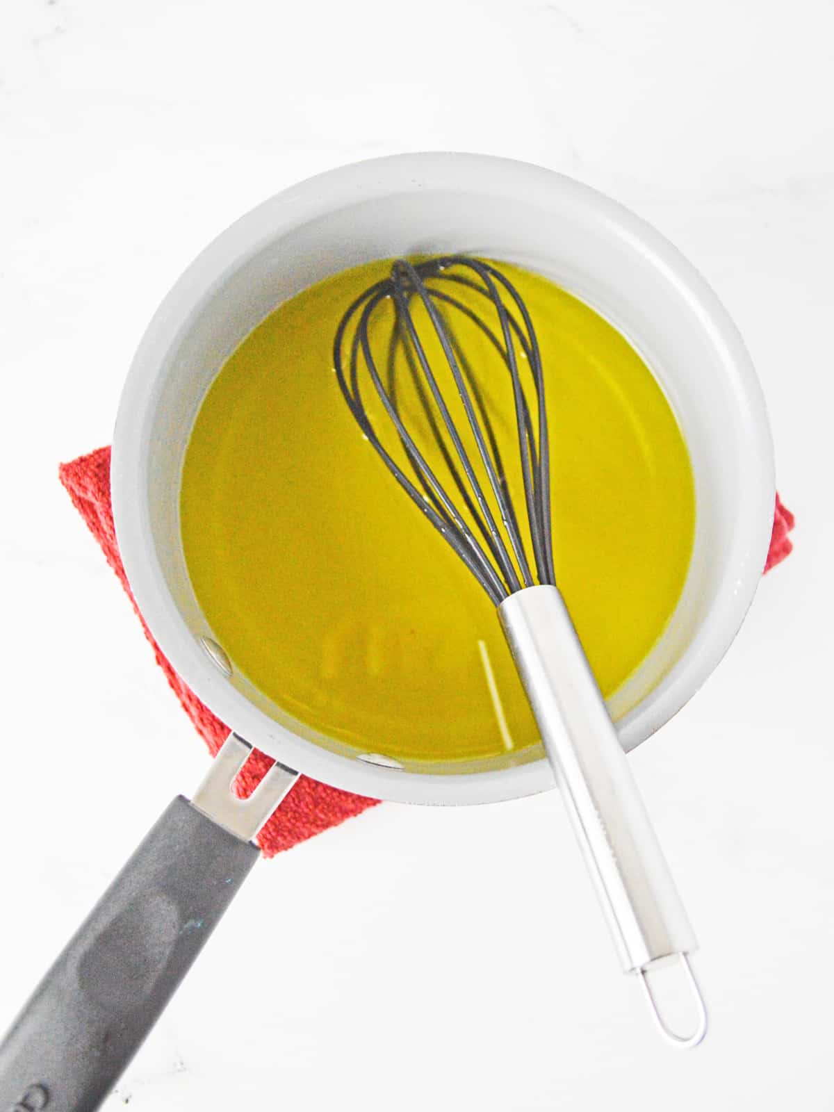 dissolved lemon gelatin with boiling water in sauce pan