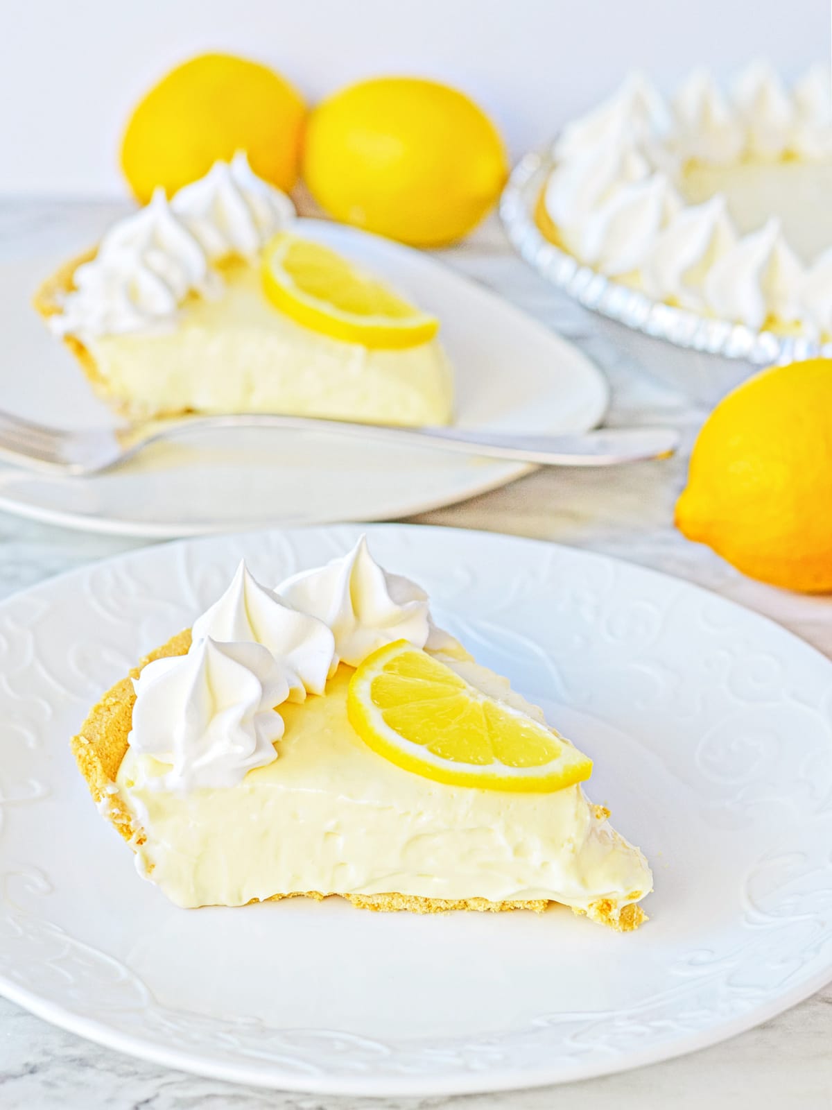 no bake lemon cheesecake slices on plates