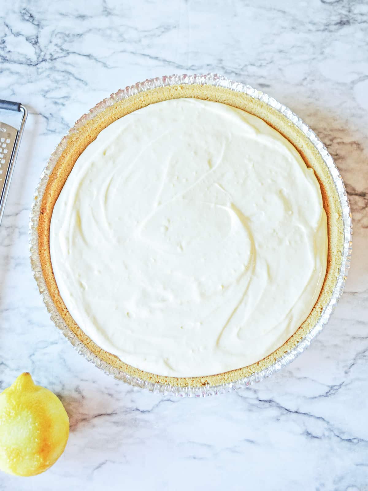 pour lemon cheesecake mixture into graham cracker crust