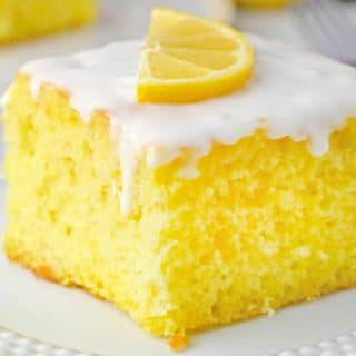 slice of Lemon Cake with glaze on white plate