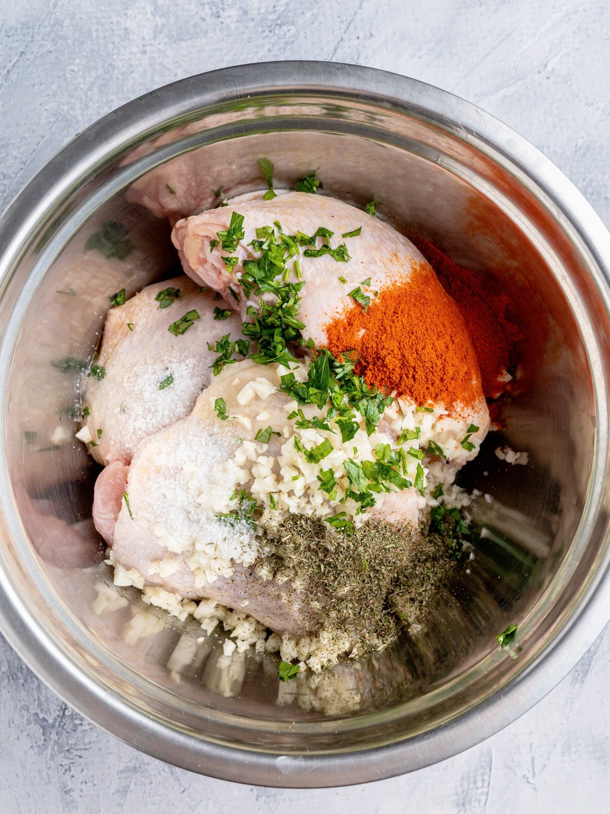 toss Chicken Thighs in bowl with seasonings