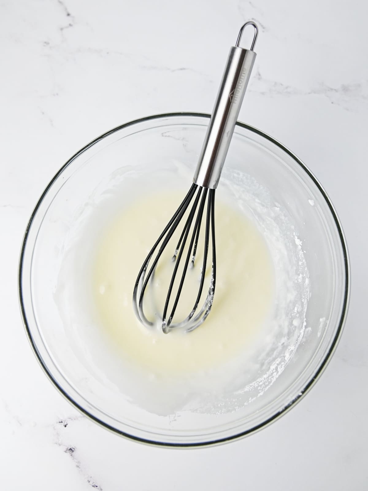 whisk icing ingredients together in bowl