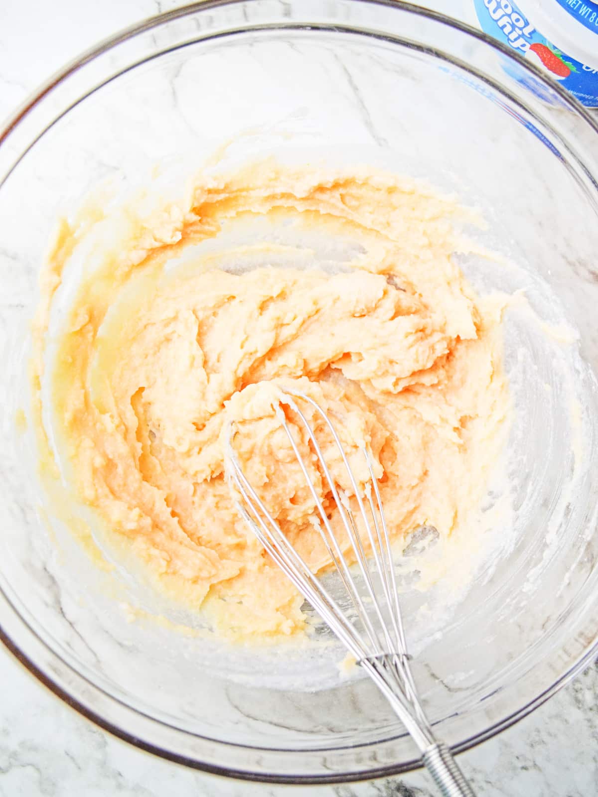 whisk together yogurt and pudding mix in mixing bowl