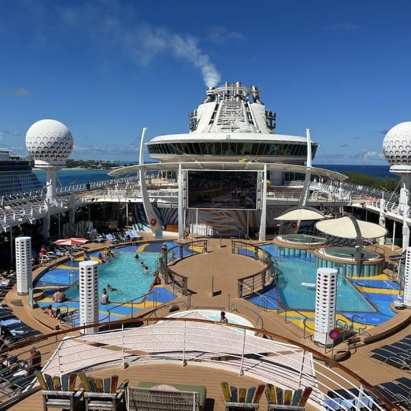 The deck of a cruise ship with a swimming pool.