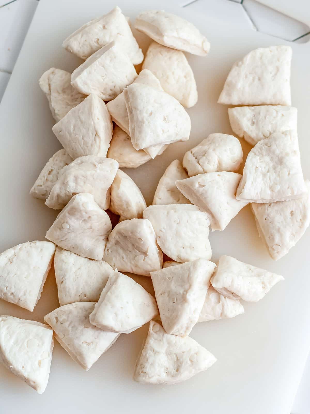 Biscuits chopped into quarter size pieces.