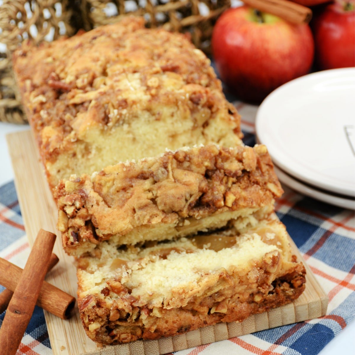 A slice of apple cinnamon bread on a cutting board.