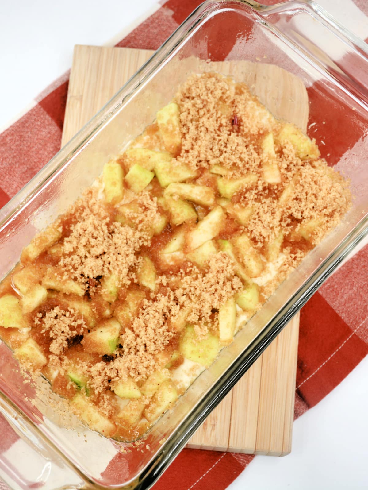 Apple crumble casserole in a glass baking dish.