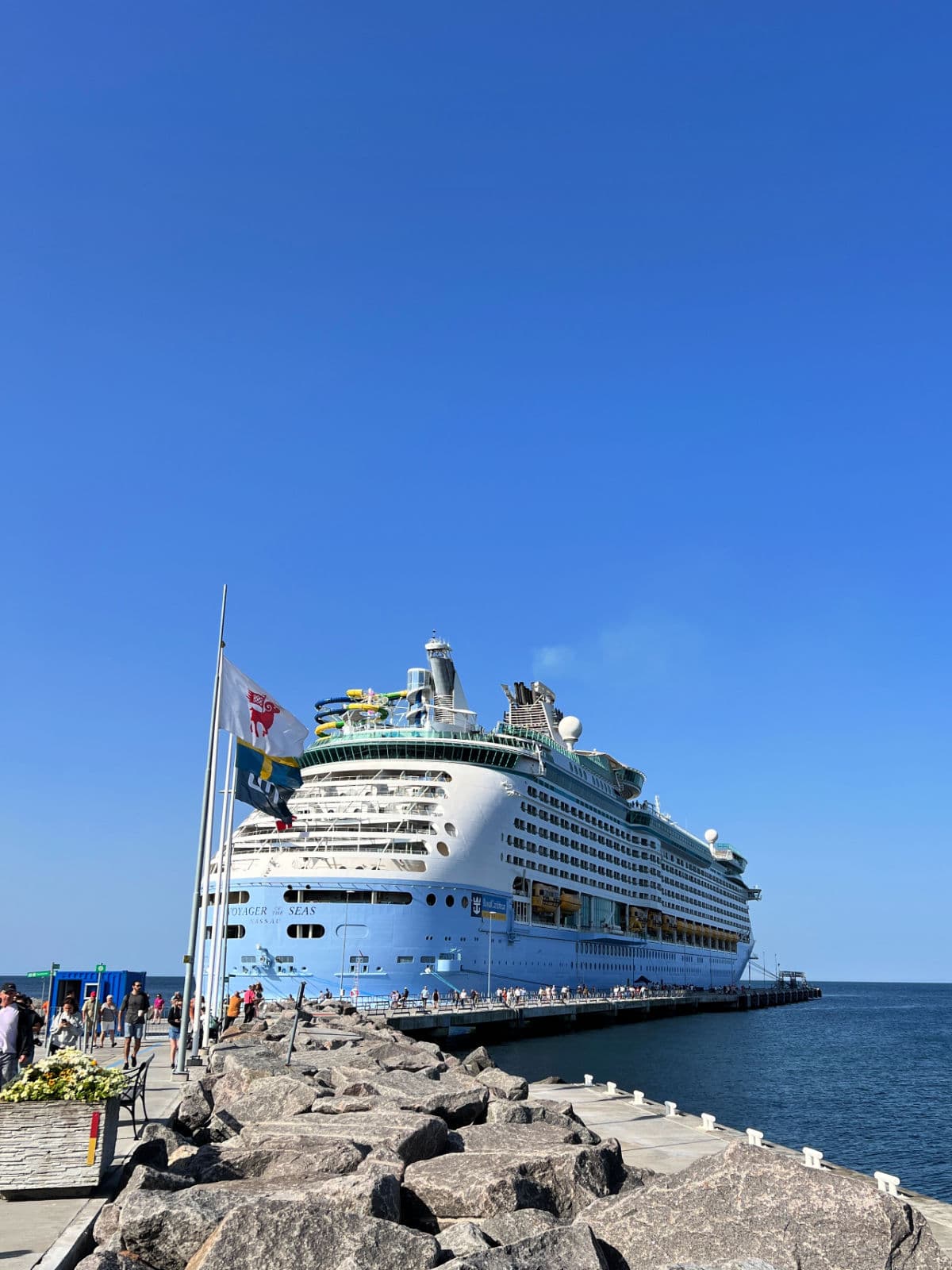 A large cruise ship docked at a dock.