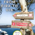 Two directional wooden signs on a hiking trail point towards Fira and Oia with a scenic backdrop of the sea and cliffs. Text overlay reads "Hiking from Fira to Oia" and "Read the tips for your Fira to Oia adventure."
