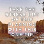 A sunset view of a desert landscape with the text "Take the stress out of trip planning with this one tip" displayed over it. The phrase "Read More" appears at the bottom.