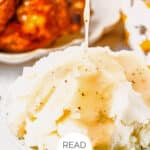 A bowl of mashed potatoes topped with turkey gravy being poured. A dish of turkey is in the background. Text on the image reads, "EASY TURKEY GRAVY" and "READ MORE.