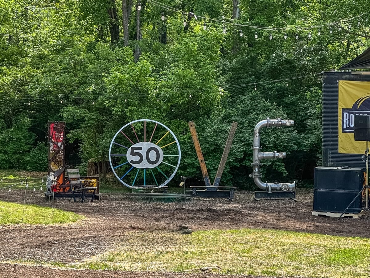 Large sculptural letters spelling "LOVE," with the "O" replaced by a wheel featuring "50," create a perfect photo op among trees and string lights&mdash;one of the unique Things to Do in Roanoke VA.